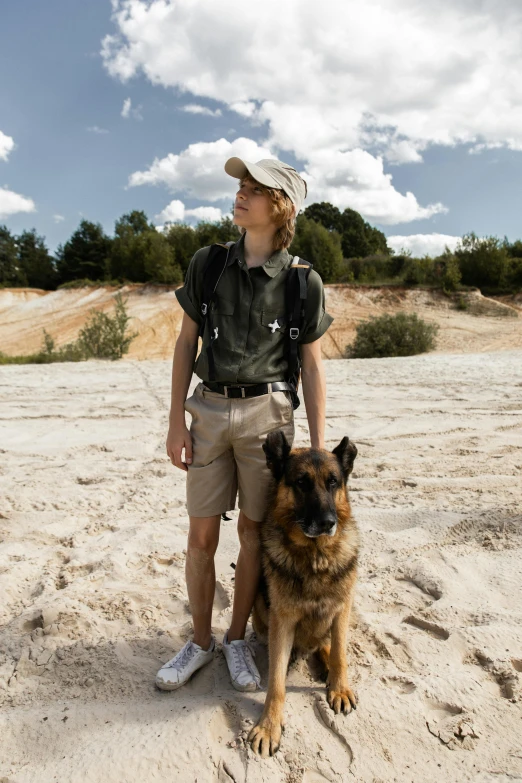 a man wearing a backpack with his dog