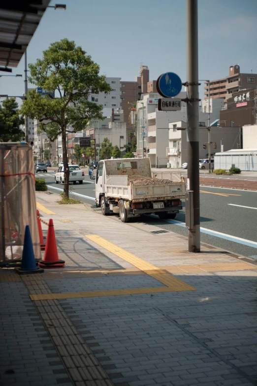 a large truck driving down a street