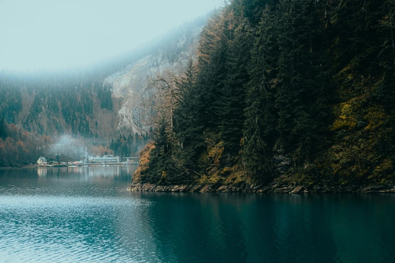 a view of a mountain lake with water near it