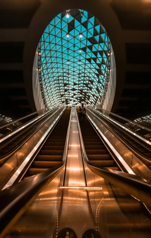 an escalator has a metal floor and some lights