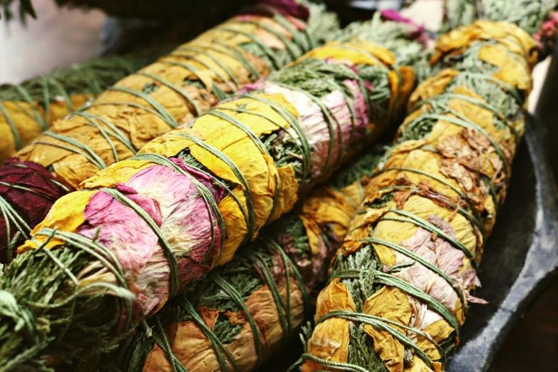 a row of bundles filled with dried food