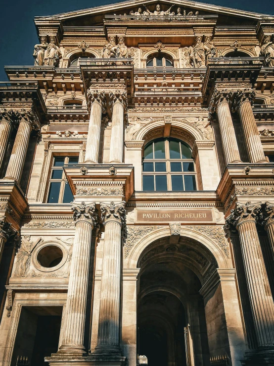 an ornate building with arches and windows on it