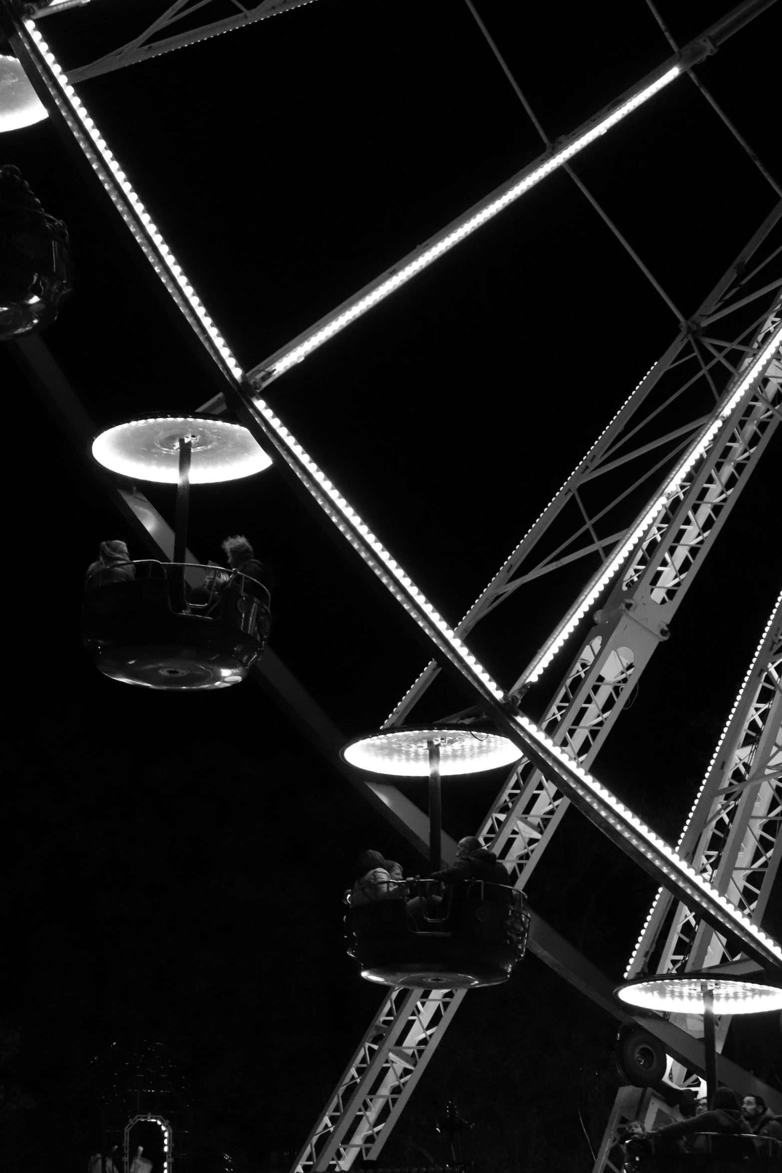 several chairs are illuminated by lights in a circus
