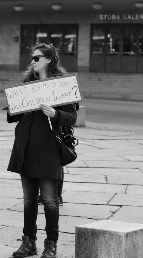 black and white po of a woman holding a sign that reads dirty frizbee clean girl gallery lemon