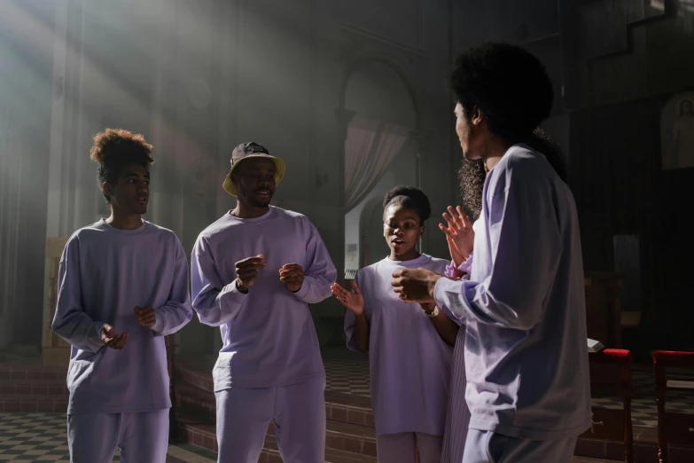 a group of boys that are wearing white clothing