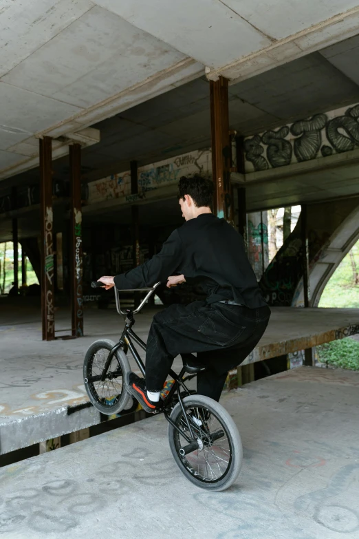 a man riding a bike in a park