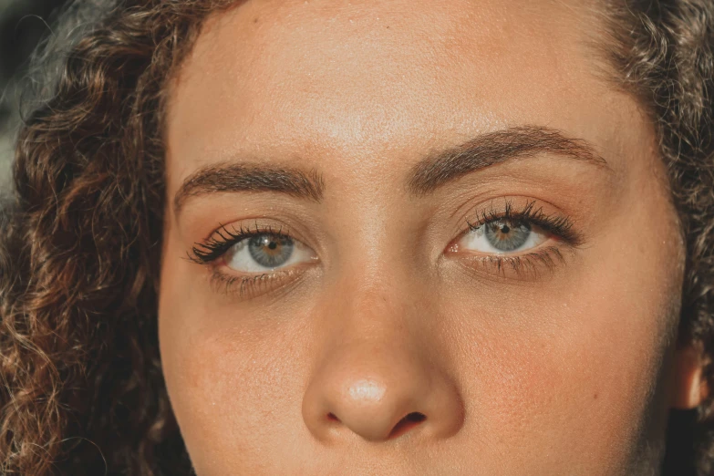 an up close s of a woman with freckled eyes