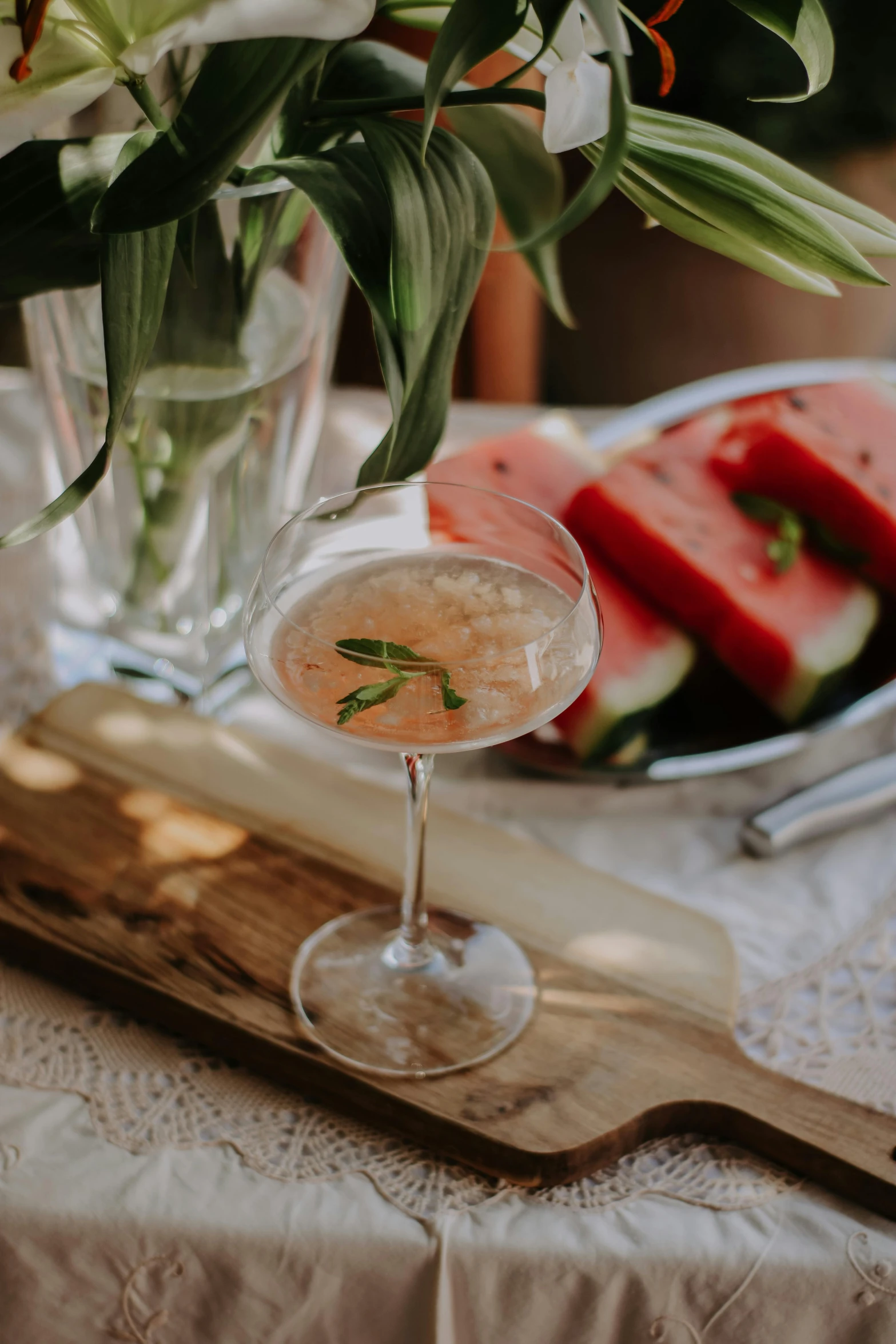 watermelon slice slices next to a drink in a glass