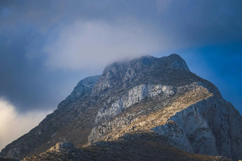 the view of an extreme mountain peak from below