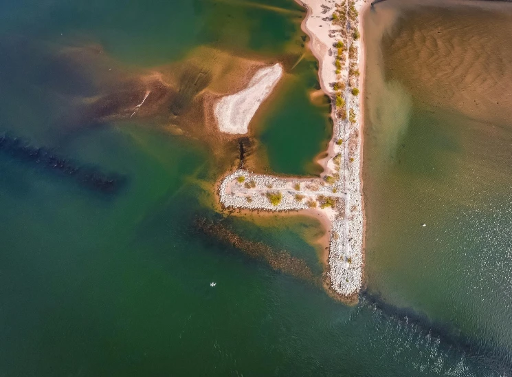 an aerial po of a pier in the water