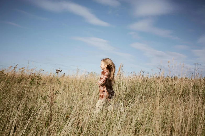 a  is standing in tall grass