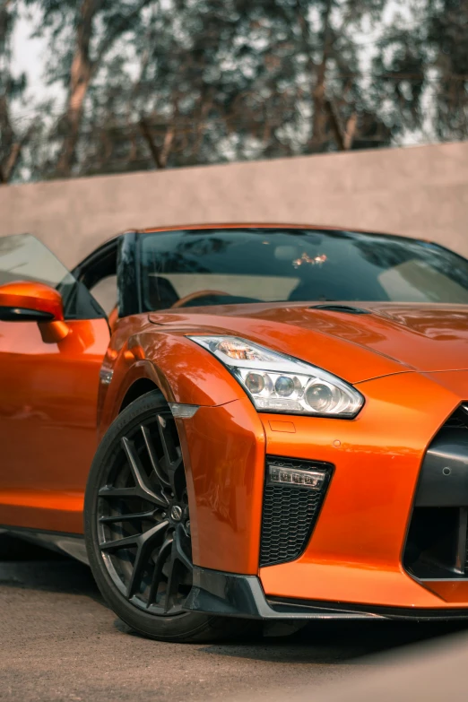 a red sports car parked on the side of a building