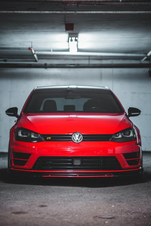 the red car is in a parking garage