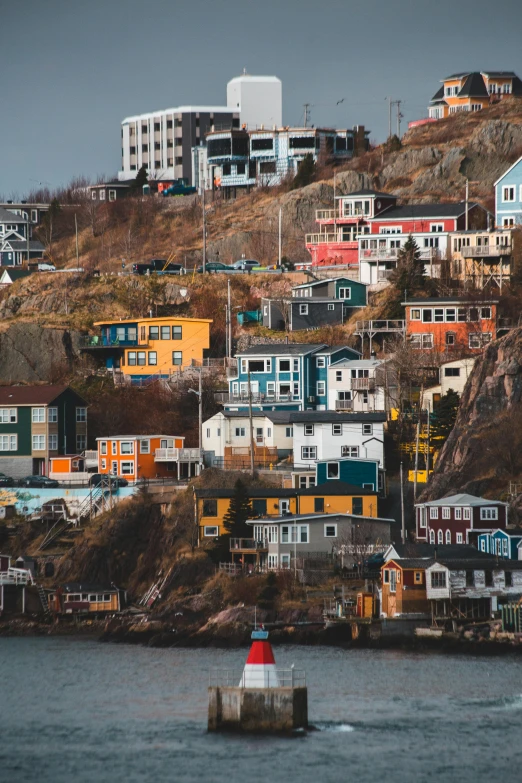 a boat that is in the water near some houses