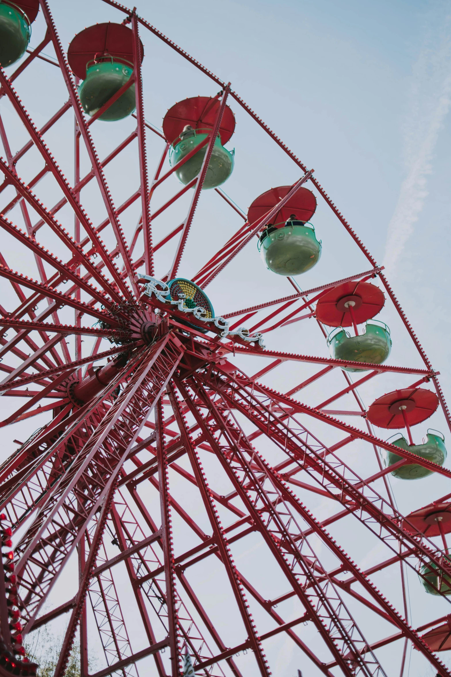 an elaborate colorful carnival ride against a blue sky