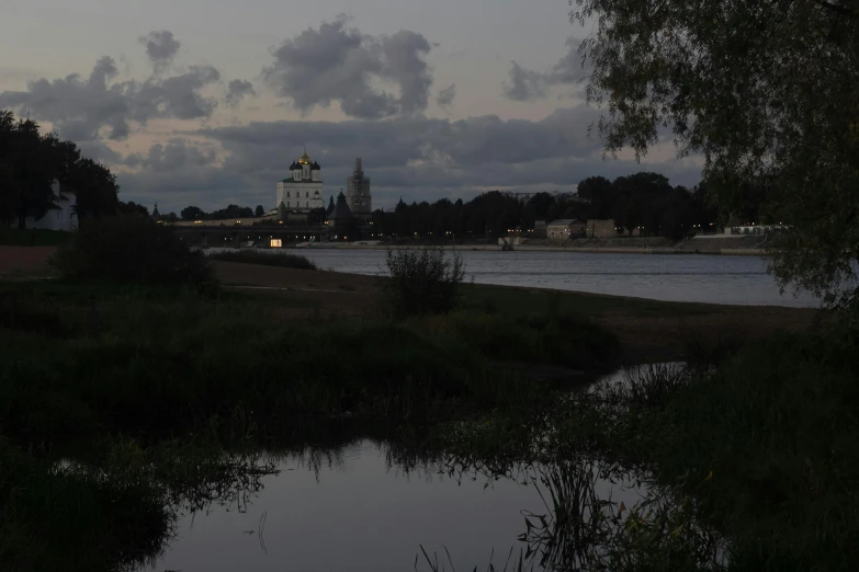 a large cathedral towering over a body of water