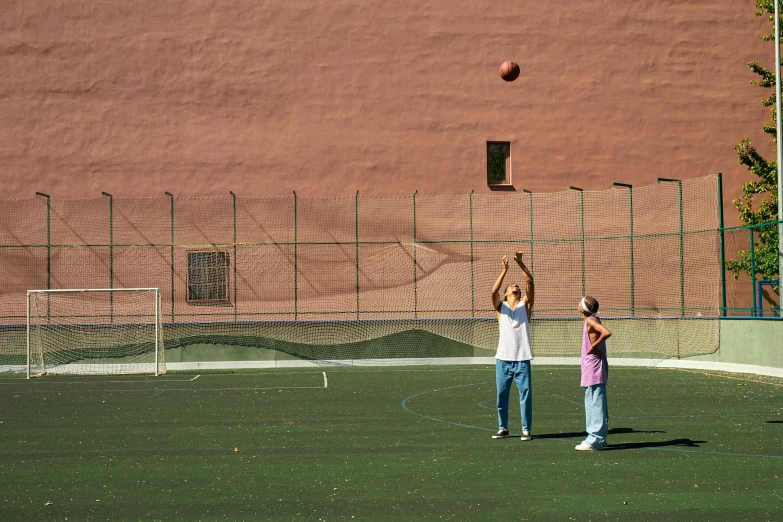 the people are playing soccer on the field