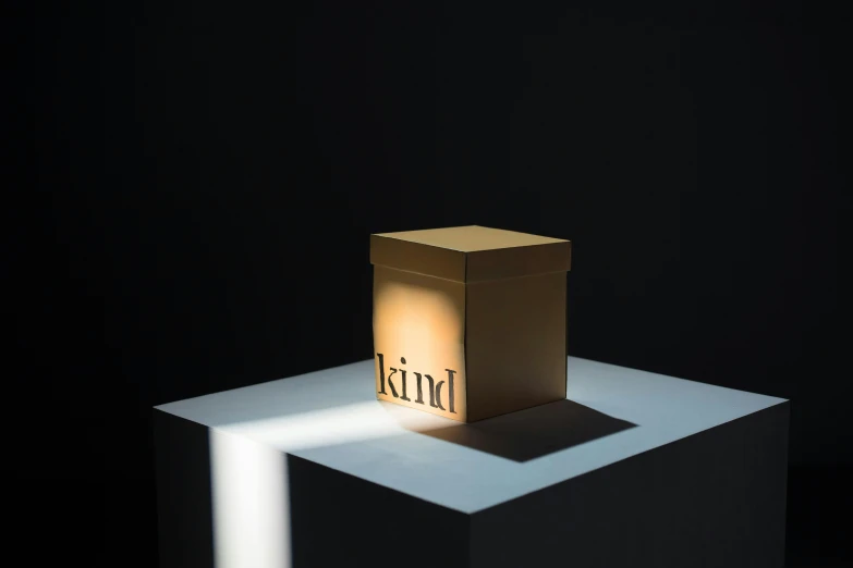 a small box sitting on top of a white surface