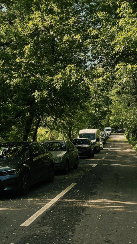 several cars parked along the side of the road