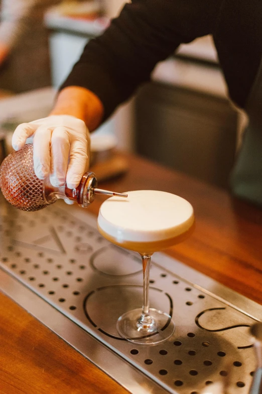 a bartender preparing a drink in the bar