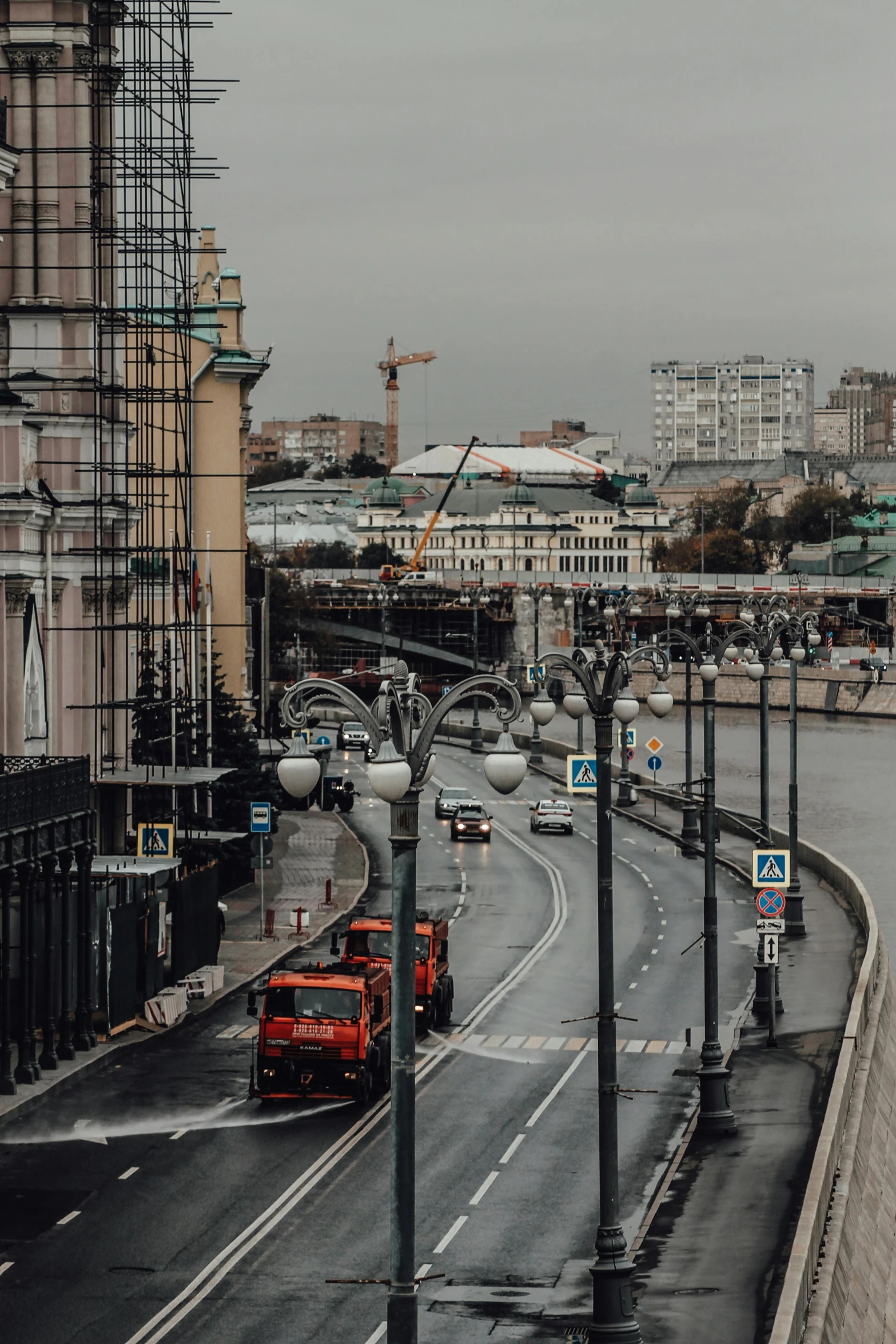 a city street with construction in the background