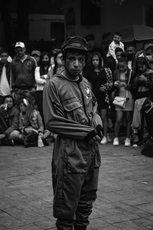 the black and white po shows a man standing in front of an audience