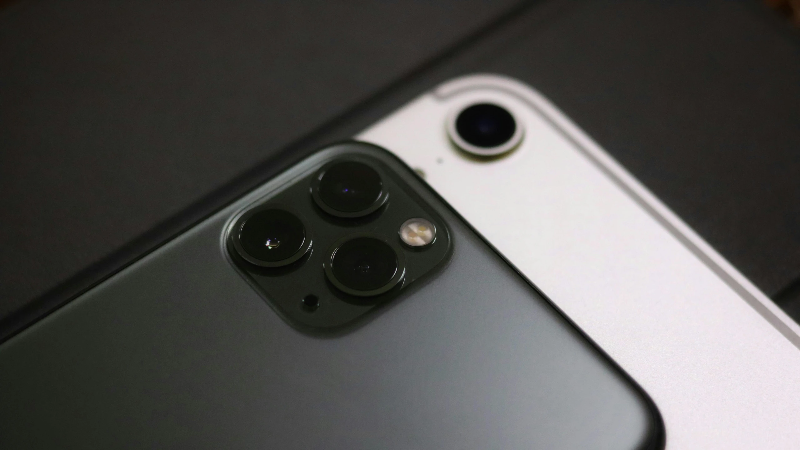 an angled image of a camera and an iphone