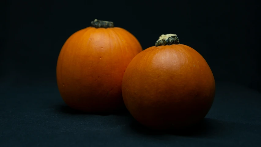 the two pumpkins are ready to be cooked on a stove