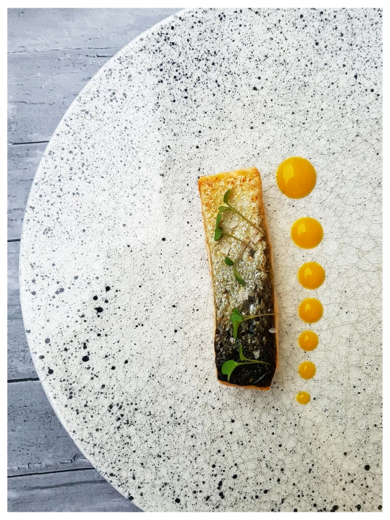 a table with an unusual looking white dish on it