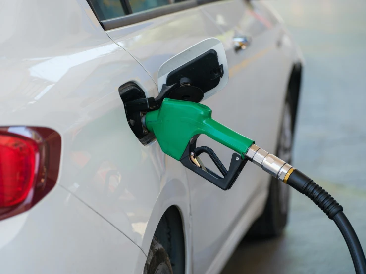 gas pump at station for gasoline to fill cars