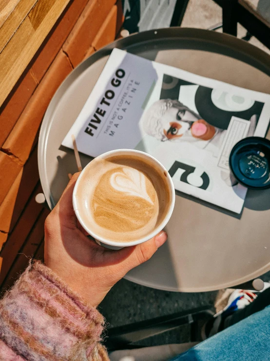 coffee and paper are shown on the table