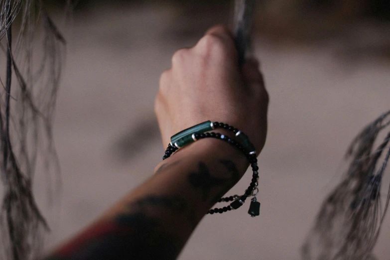 a person with some beads on their wrist