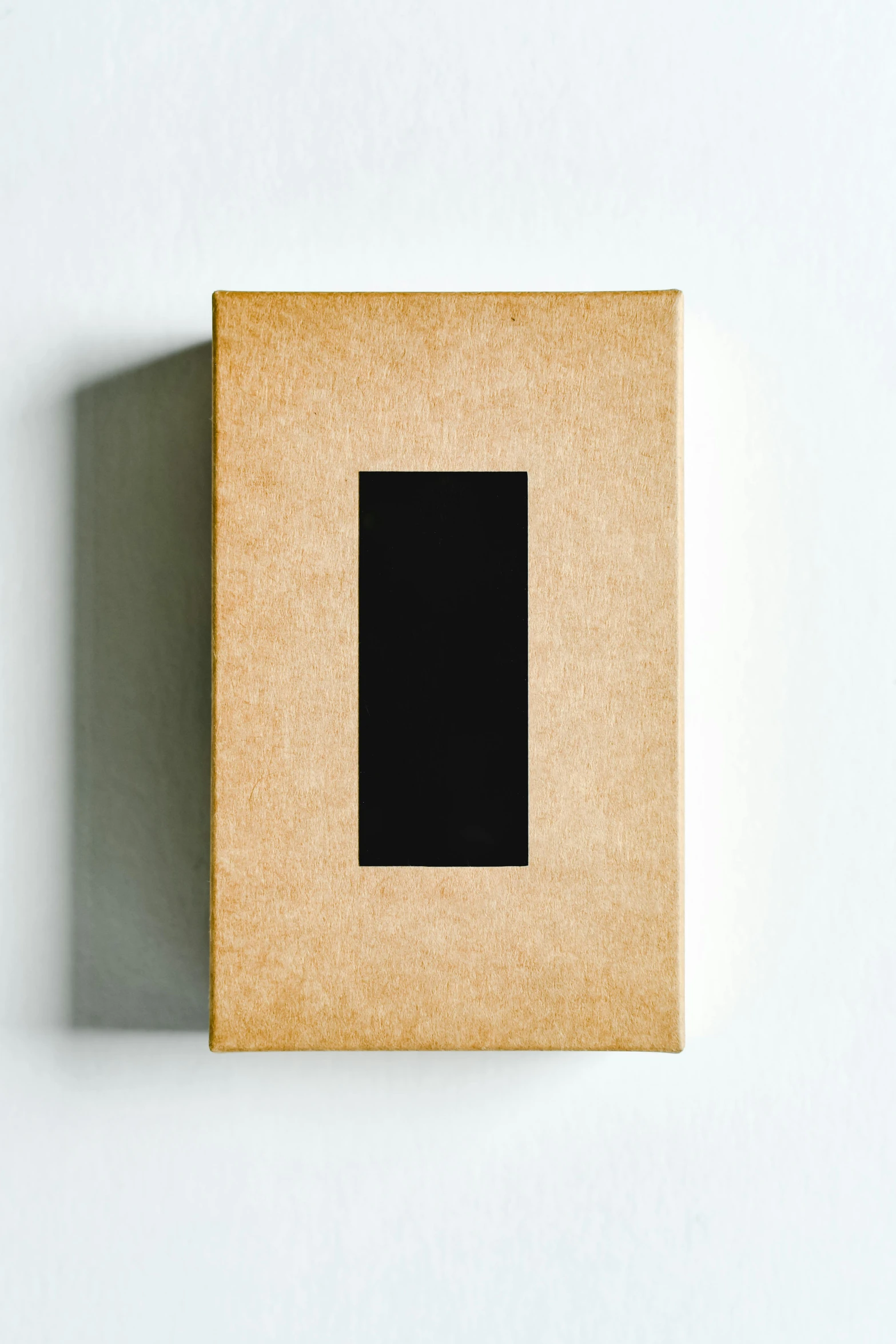 an empty square on a piece of cardboard