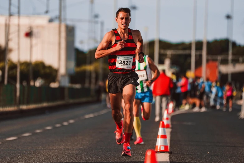 men running on the road at an event