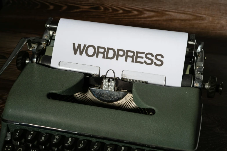 the words wordpress are printed on a paper on an old - fashioned typewriter