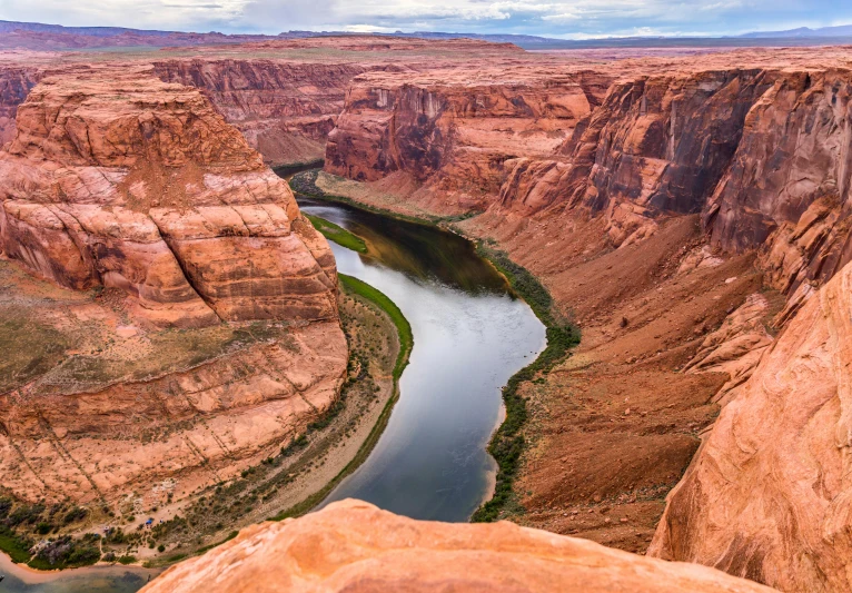 there is a river running between some large rocks