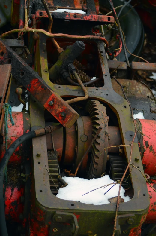 an old abandoned airplane gears and gear, some rusted, are shown