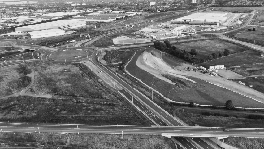 an aerial view of a highway and several buildings