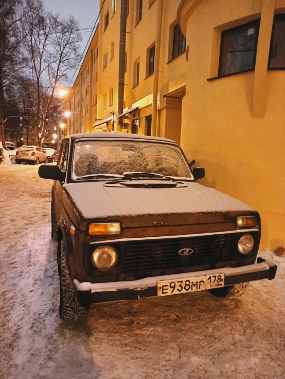 an old car parked on the side of the street