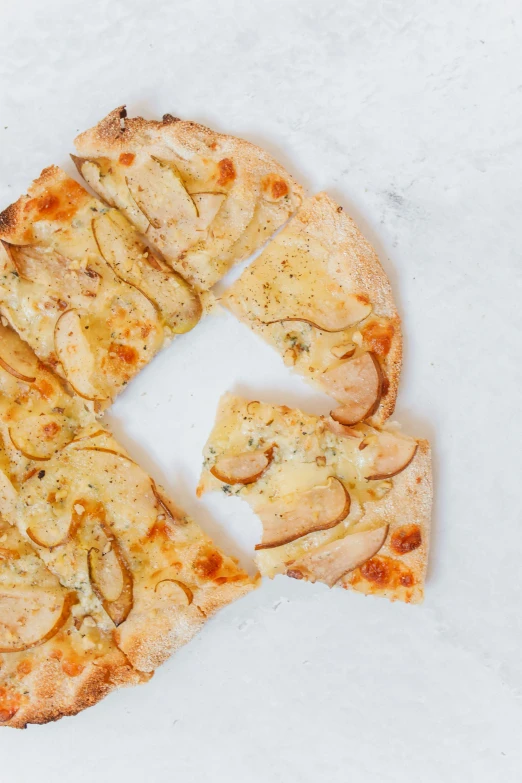 the pizza has been sliced and sitting on a counter