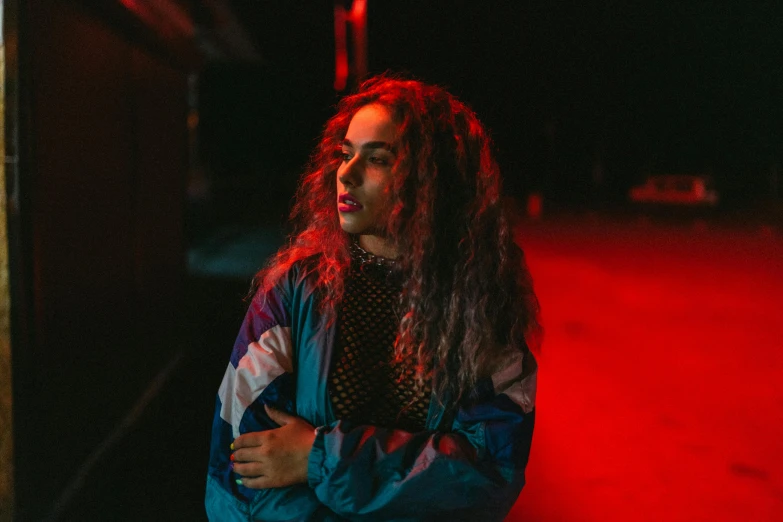 an image of a woman walking alone at night