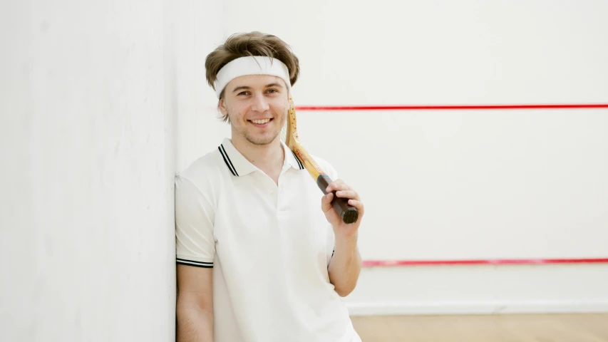 a tennis player holding a racket over his face