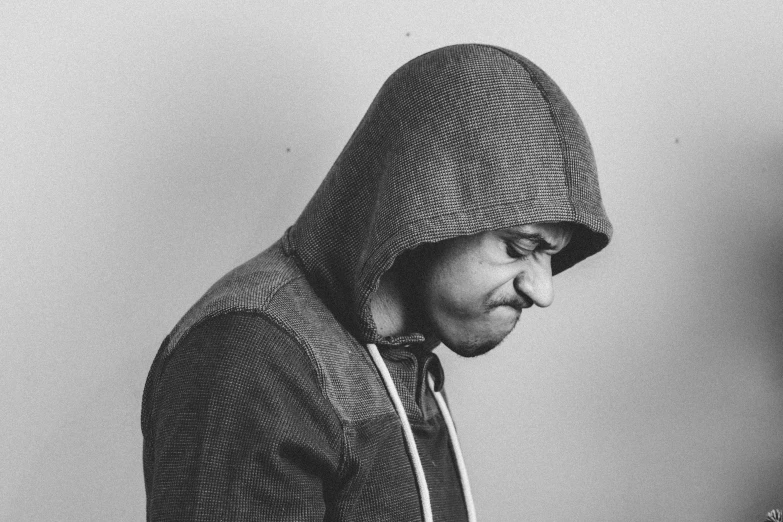 a black and white po of a man in a hoodie