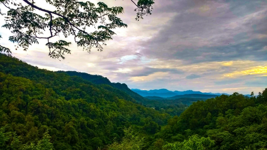 a hill that has some mountains in the background