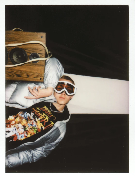 a  wearing goggles and a jacket