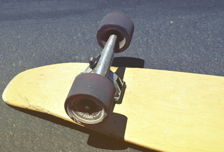 a skateboard sitting upright on the ground