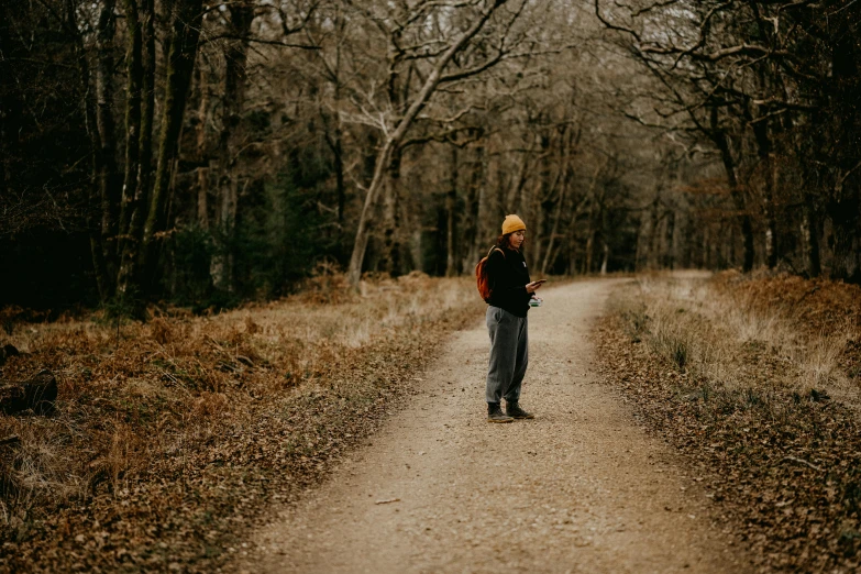 a young woman in the middle of a road