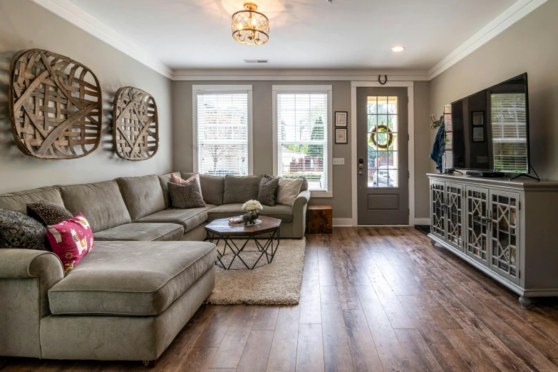 living room with hardwood flooring, sofa and television