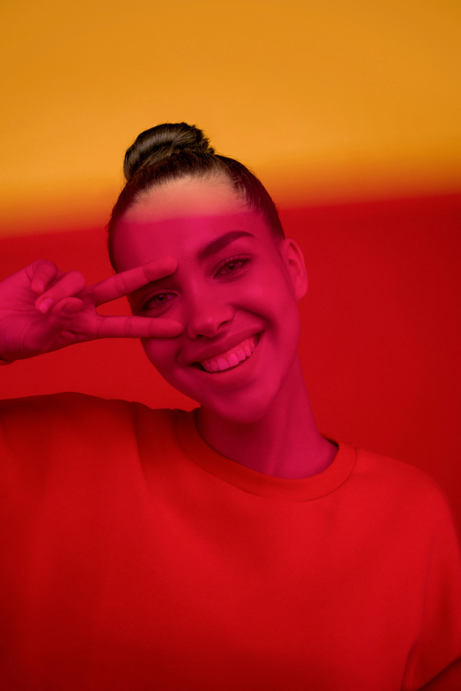 a women holding her eye in front of the camera