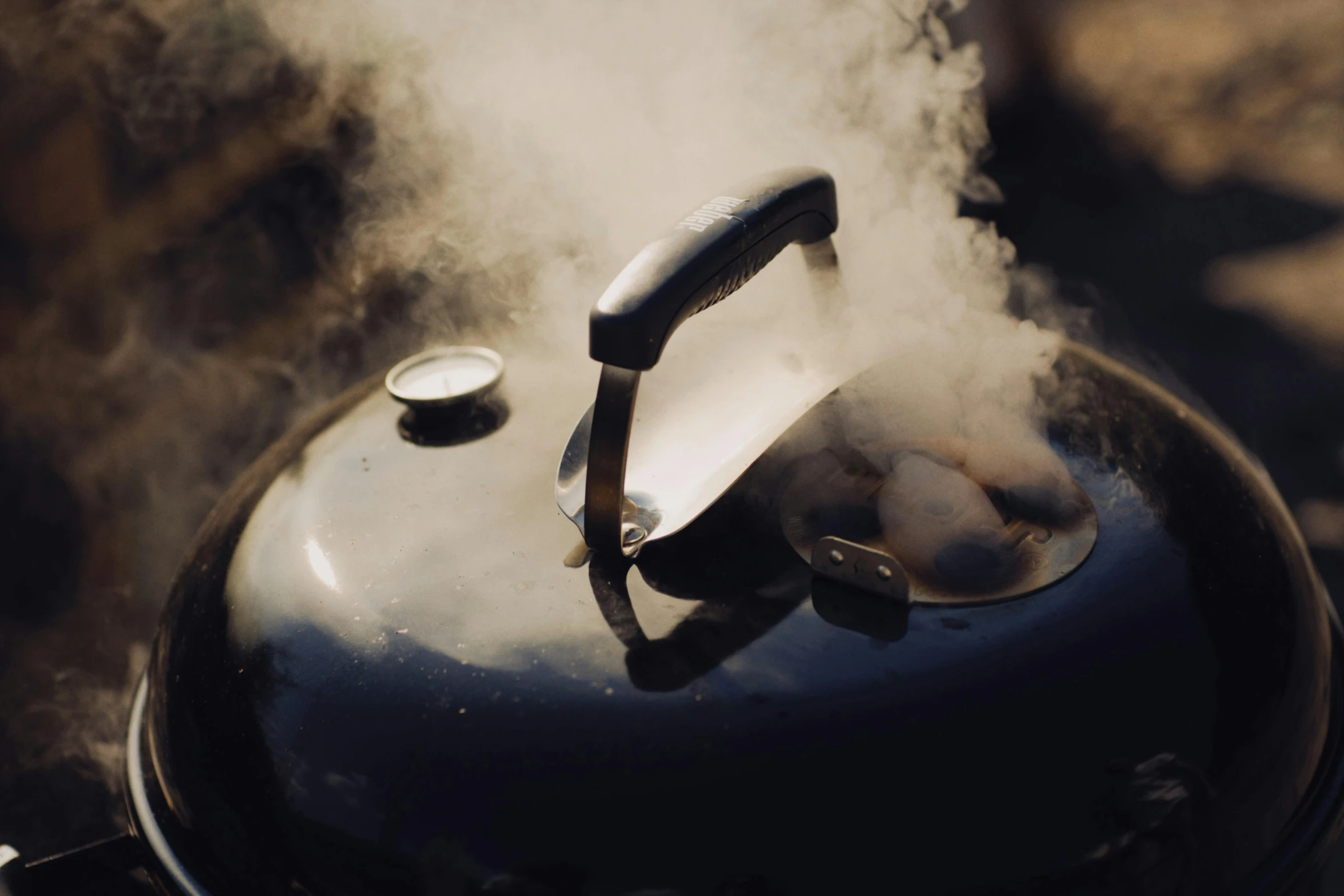 the kettle is being used to cook  dogs